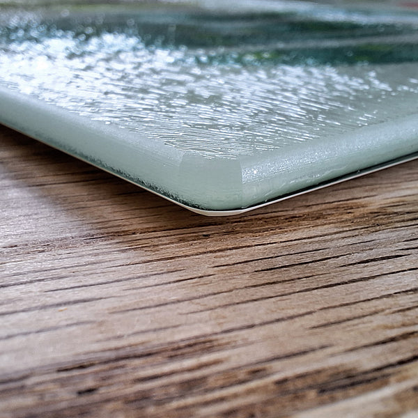 Close up view of a Rollerdog chopping board, showing the thickness and texture of the glass