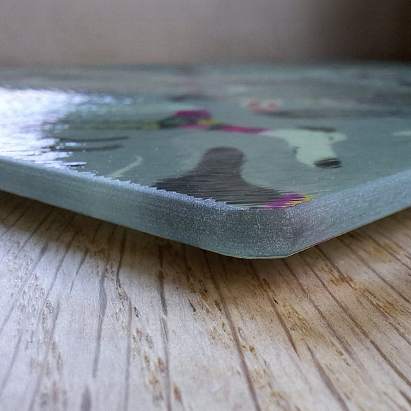 Close up of a Rollerdog Sleepy Sighthounds chopping board, showing the thickness of the glass and the textured surface