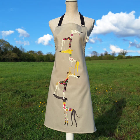 A Graceful Greyhounds apron by Rollerdog, shown on a mannequin in the countryside
