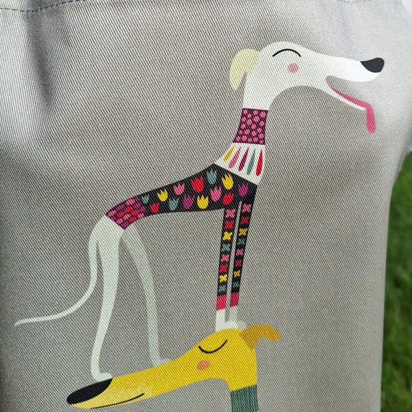 One of the dogs in the Graceful Greyhounds design on a Rollerdog apron