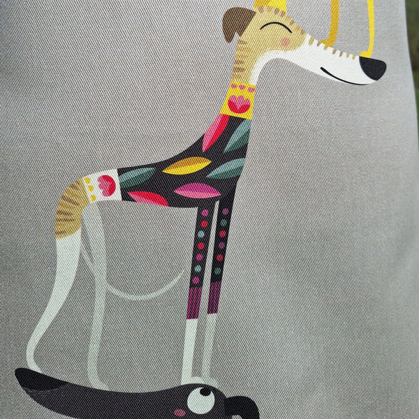 One of the dogs in the Graceful Greyhounds design on a Rollerdog apron