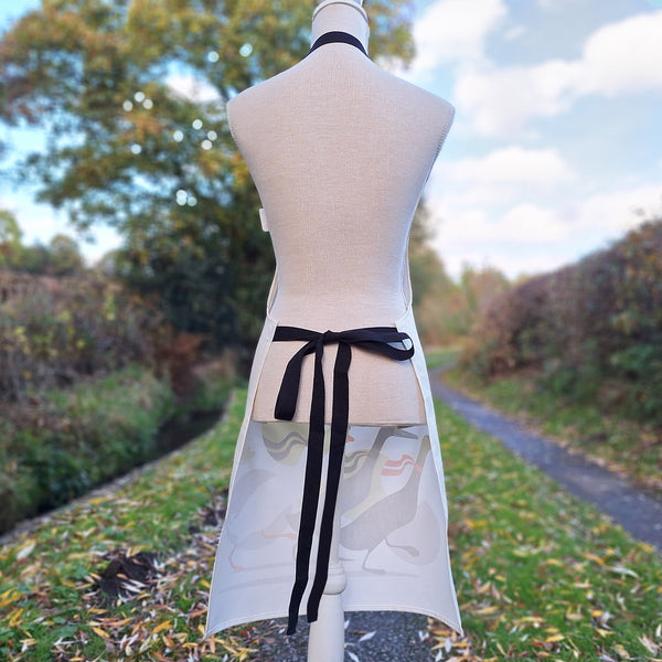 The back view of a Derbyshire Ducks pinny showing the long black waist ties