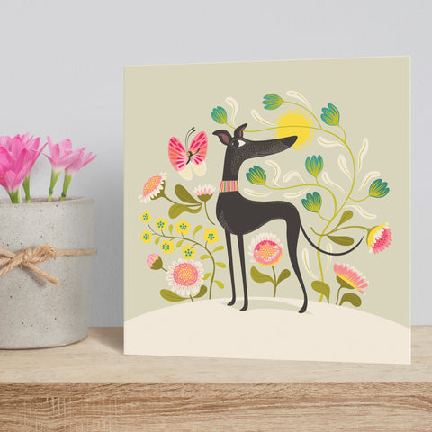 Freddie the Tripod greeting card by Rollerdog, picturing a three legged greyhound on a background of flowers