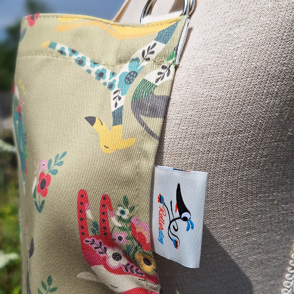 A close up view of a Bloomin Hounds apron, showing the texture of the cotton fabric
