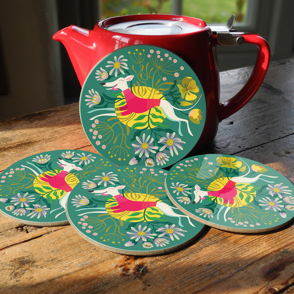 Snowy the Whippet coaster set, featuring a white whippet leaping through a colourful, seaside-themed scene