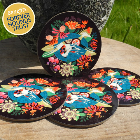 A set of 4 Flower Bed coasters by Rollerdog, photographed outside