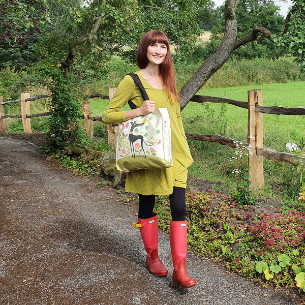 A Freddie the tripod greyhound tote bag in use as a shoulder bag 