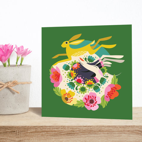 Hare-brained Dreams greeting card by Rollerdog, featuring a sleeping white hound under a leaping golden hare