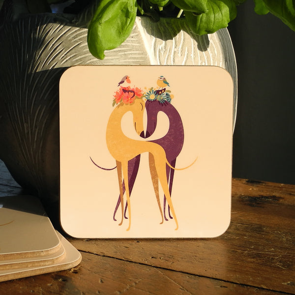 A Hounds of Love coaster photographed upright in the evening light