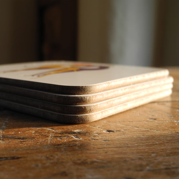 A stack of Rollerdog Hounds of Love coasters