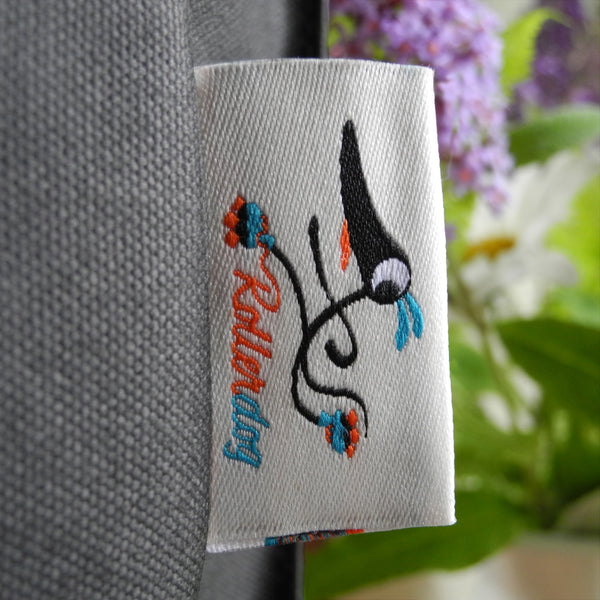 The embroidered Rollerdog label on a Poppy tote bag