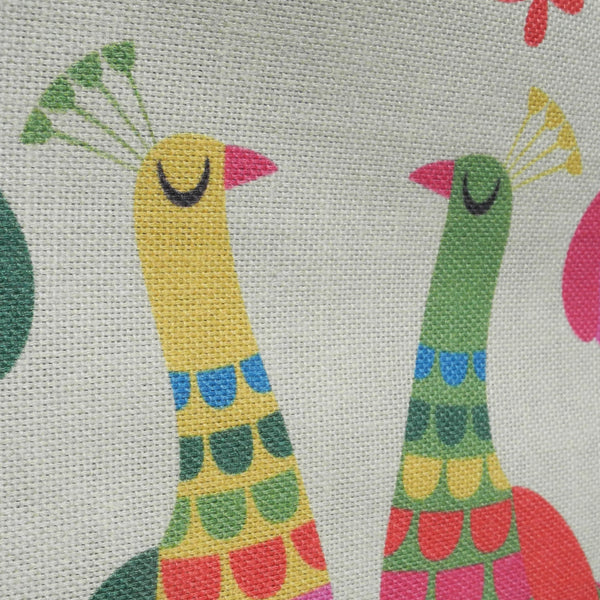 A close up view of the cotton fabric of a Haughty Peacocks tea towel