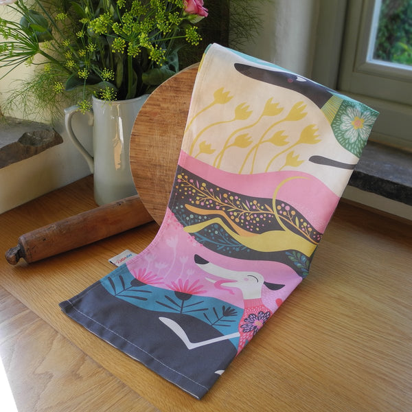 Zoomies tea towel by Rollerdog