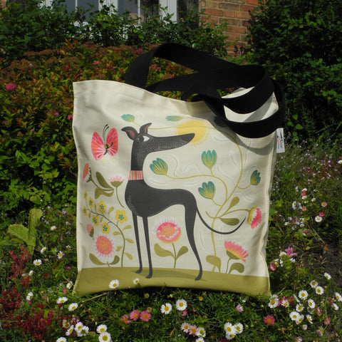 Freddie the Tripod tote bag, featuring an illustration of a three-legged greyhound on a floral background