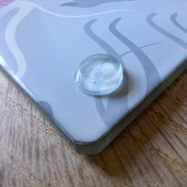 Close up of a rubber foot on the base of a Rollerdog glass chopping board