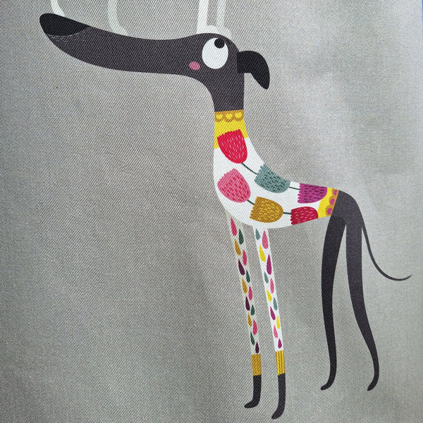 One of the dogs in the Graceful Greyhounds design on a Rollerdog apron