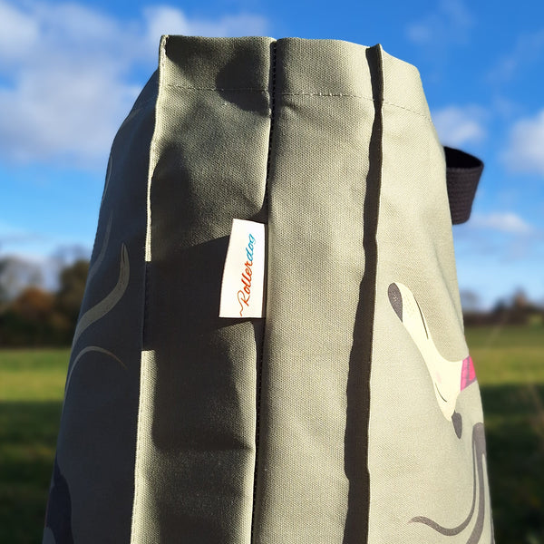The side of a Sleepy Sighthounds tote bag, showing the gussetted sides and Rollerdog branded label