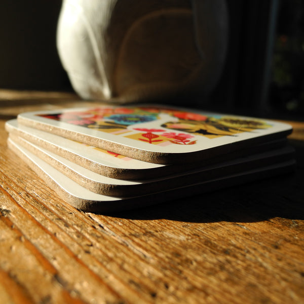 A stack of 4 coasters featuring the Dog Rose design by Rollerdog