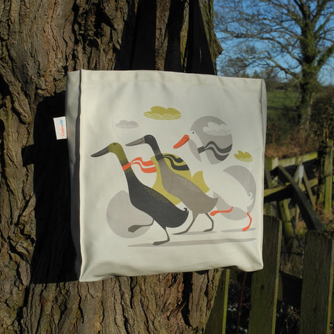 A Three Ducks from Derbyshire tote bag by Rollerdog, shown outside in the sunshine