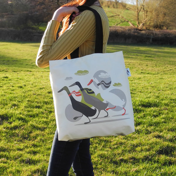 A Three Ducks from Derbyshire tote bag by Rollerdog, shown in use as a shoulder bag