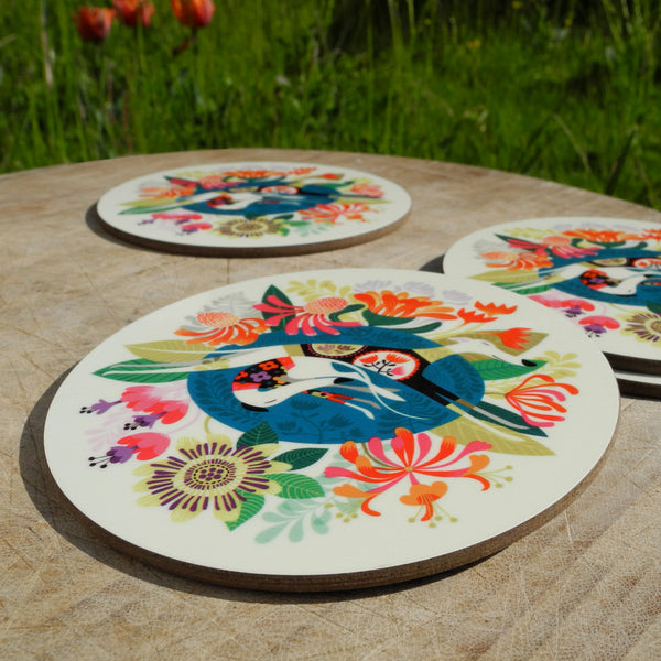 Close up of a set of Rollerdog Flower bed coasters