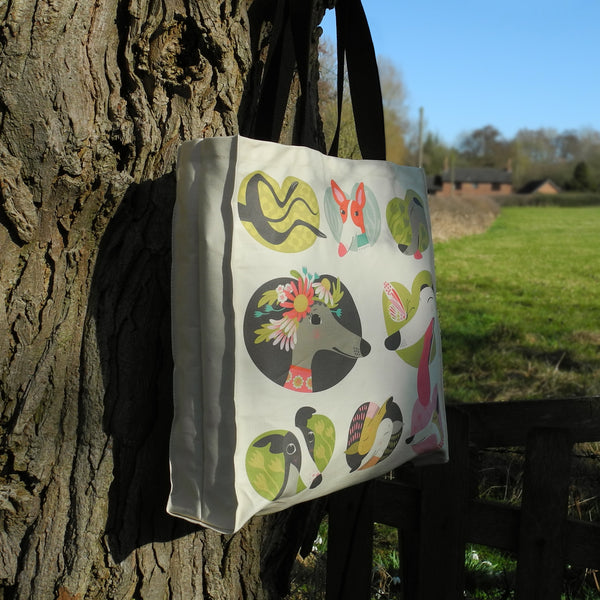 Side view of a Noses and Poses tote bag by Rollerdog