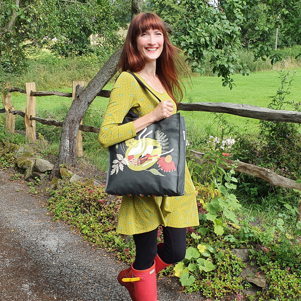 Poppy the greyhound tote bag in use as a shoulder bag
