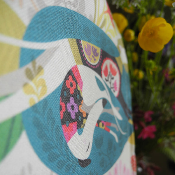A close up of a Flowerbed tea towel, showing the cotton fabric and print quality