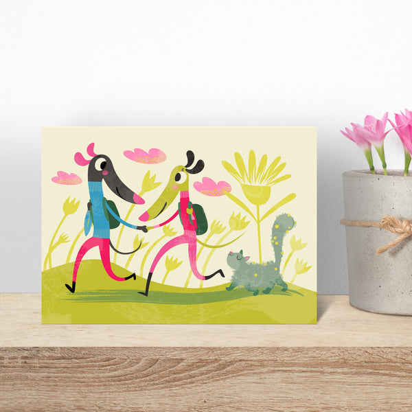 A Trotting card by Rollerdog, shown on a wooden shelf next to a pot of crocus
