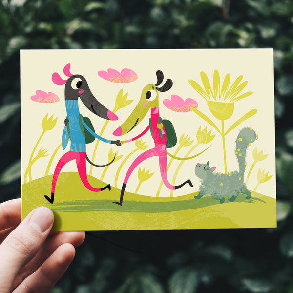 Trotting card by Rollerdog, shown being held outside against a bank of foliage