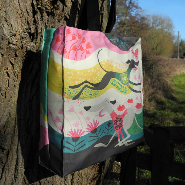 The side view of the front of a Rollerdog Zoomies tote bag