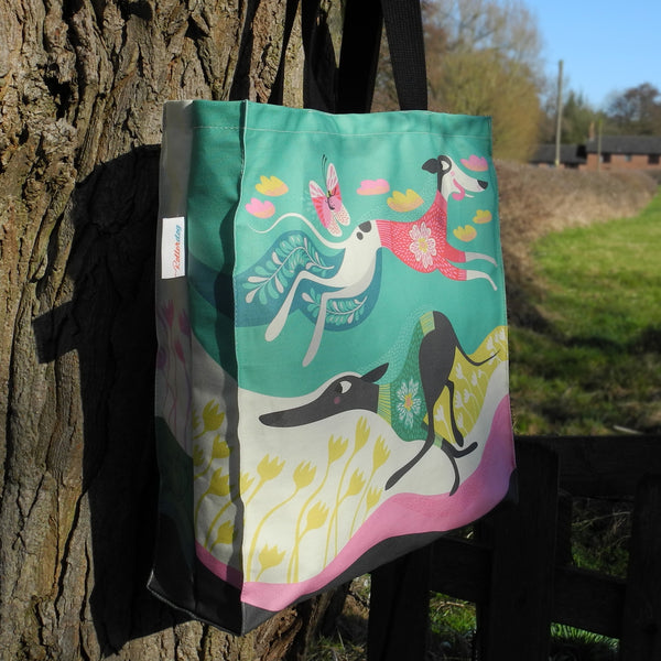 The side view of the back of a Rollerdog Zoomies tote bag