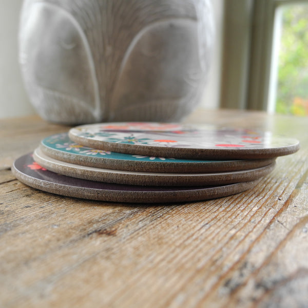 A stack of 4 Forever Hounds Trust coasters