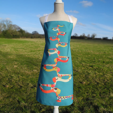 Front view of Dashing Dachshunds apron by Rollerdog