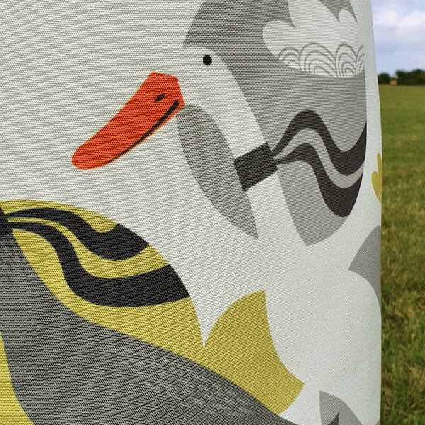 Close up view of the fabric of a Rollerdog Three Ducks from Derbyshire Apron